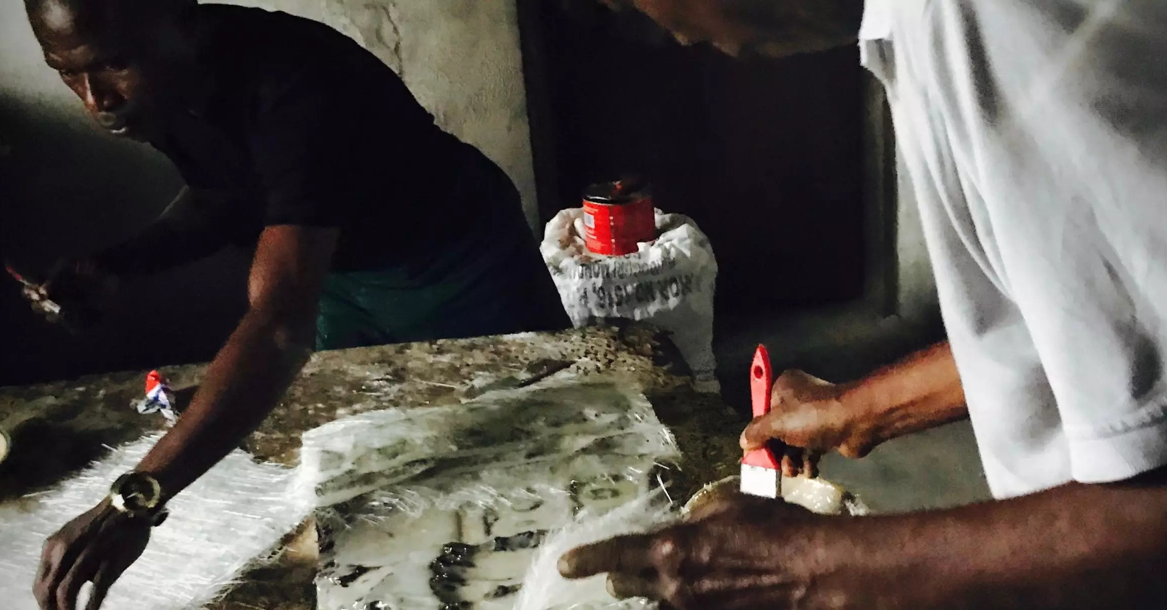 Two men painting 