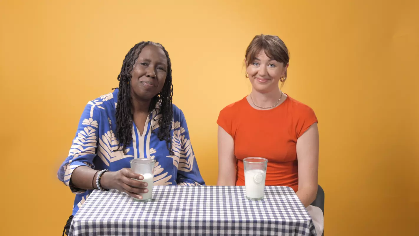 JC Niala and Johanna Zetterström-Sharp at a table with glasses of milk