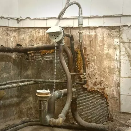 Broken, aged, bathroom pipes 