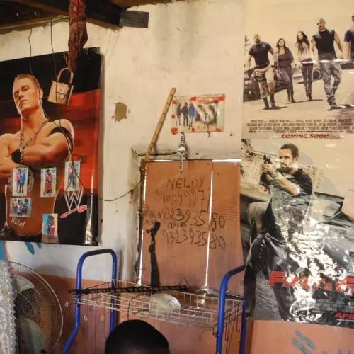 A room with posters from action films