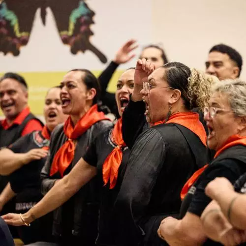 Representatives of Mākereti's tribe, Tūhourangi, performing a traditional Māori chant to welcome Mākereti's spirit and her family during the Māori remembrance ceremony held at the Natural History Museum. 