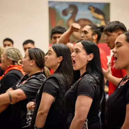Representatives of Mākereti's tribe, Tūhourangi, performing a traditional Māori chant to welcome Mākereti's spirit and her family during the Māori remembrance ceremony held at the Natural History Museum. 