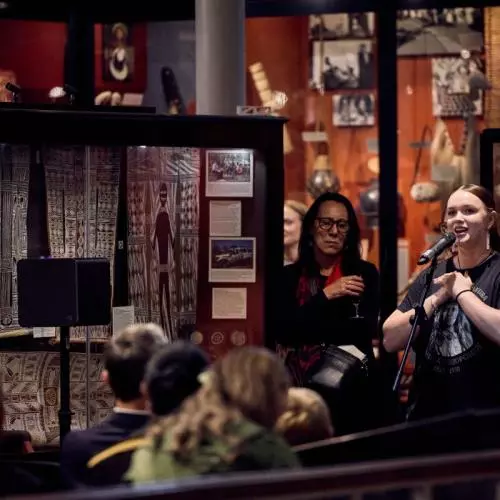 Nikau Grace, June's granddaughter, performing songs at the reception at the Pitt Rivers Museum. 