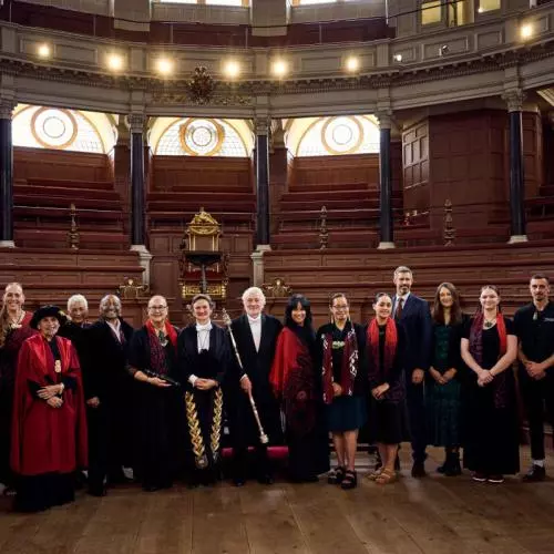 Professor Irene Tracy, Vice-Chancellor of the University of Oxford, joins Mākereti's family and guests for a group photo in the Sheldonian Theatre after the graduation ceremony.