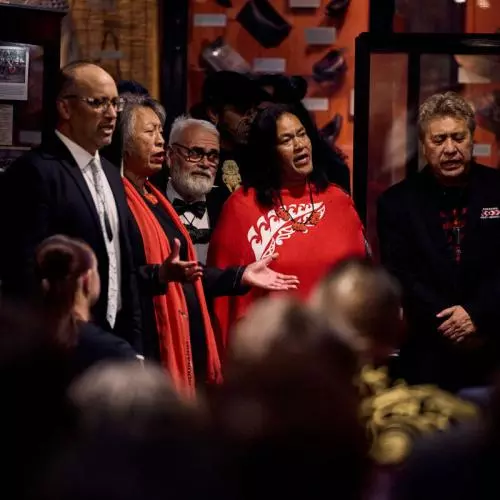 Members of the Tūhourangi iwi performing songs at the reception at the Pitt Rivers Museum. 