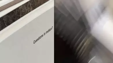 'questions in motion' typed on a card with blur