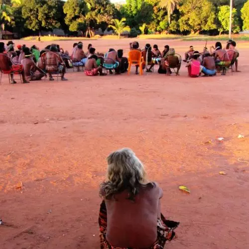 miller 3  a woman looks on as a meeting of the all male leadership council takes place escalvado brazil