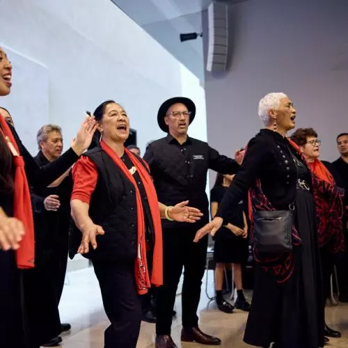 Members of the Māori community perform songs of appreciation during lunch at the Weston Library.