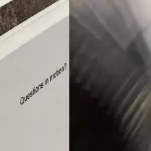 'questions in motion' typed on a card with blur